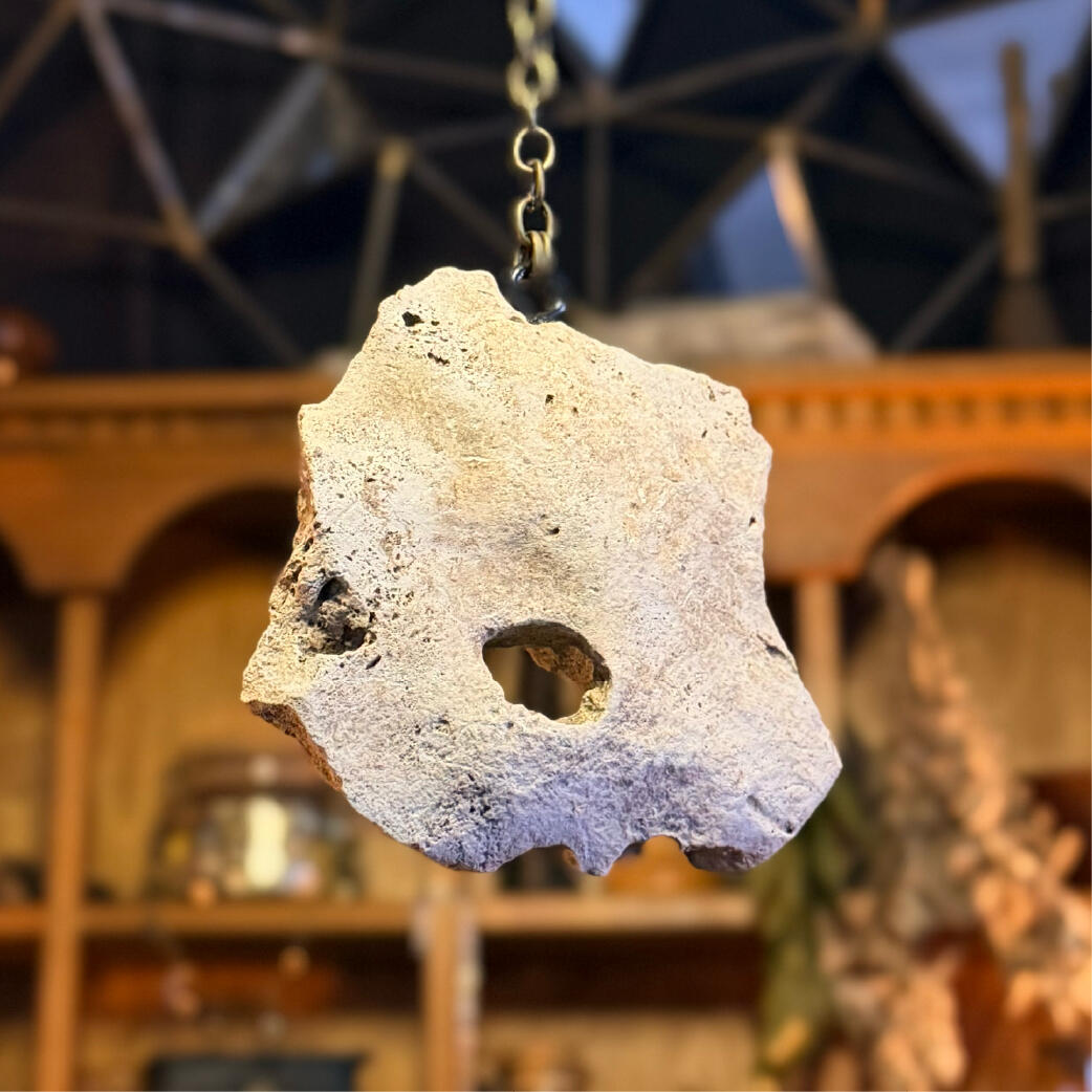 Hagulum - Look through Hagstone hung on a long chain with the natural hole catching light, seeing and warding pendulum, Hagulum by WMFrewolfe